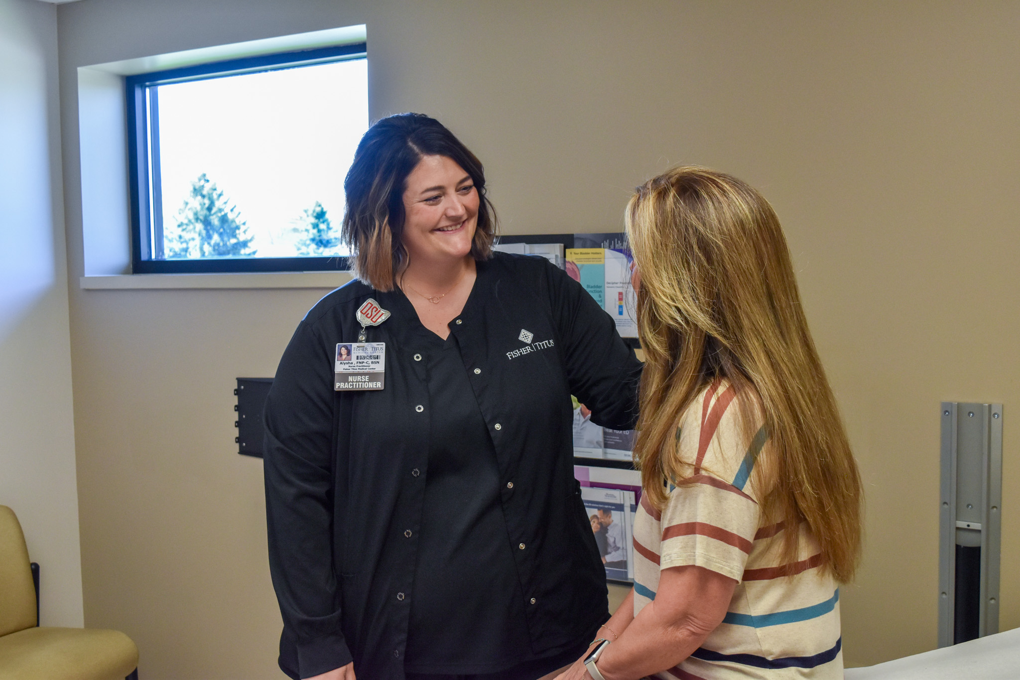 Alysha Galea speaks with a patient.