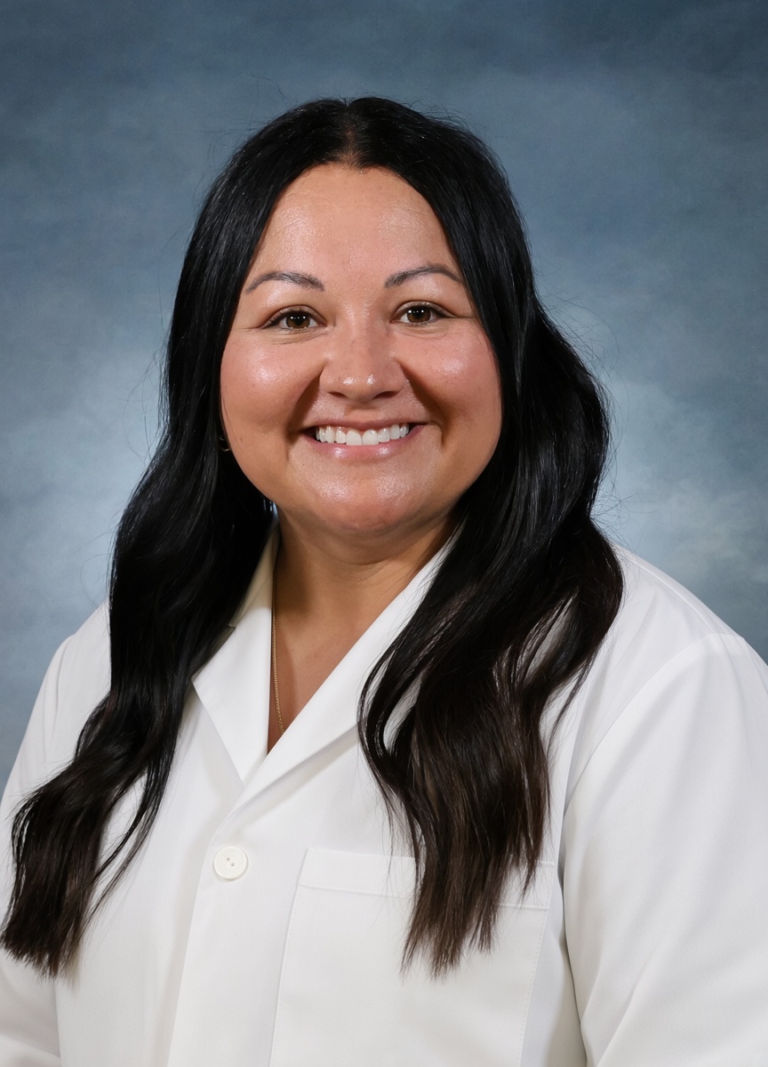 Jodi Obermeyer in a white coat.