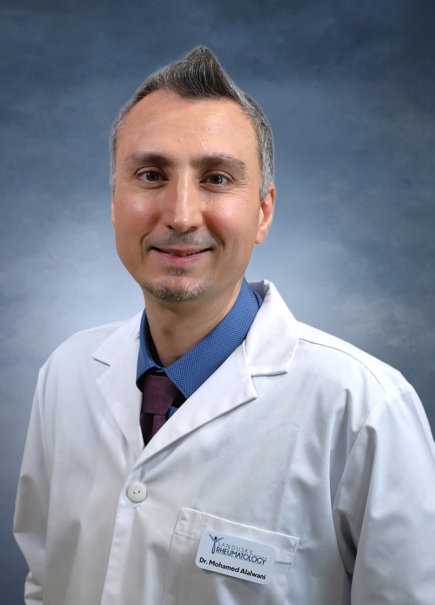Mohamed Alalwani, MD, in a white coat.