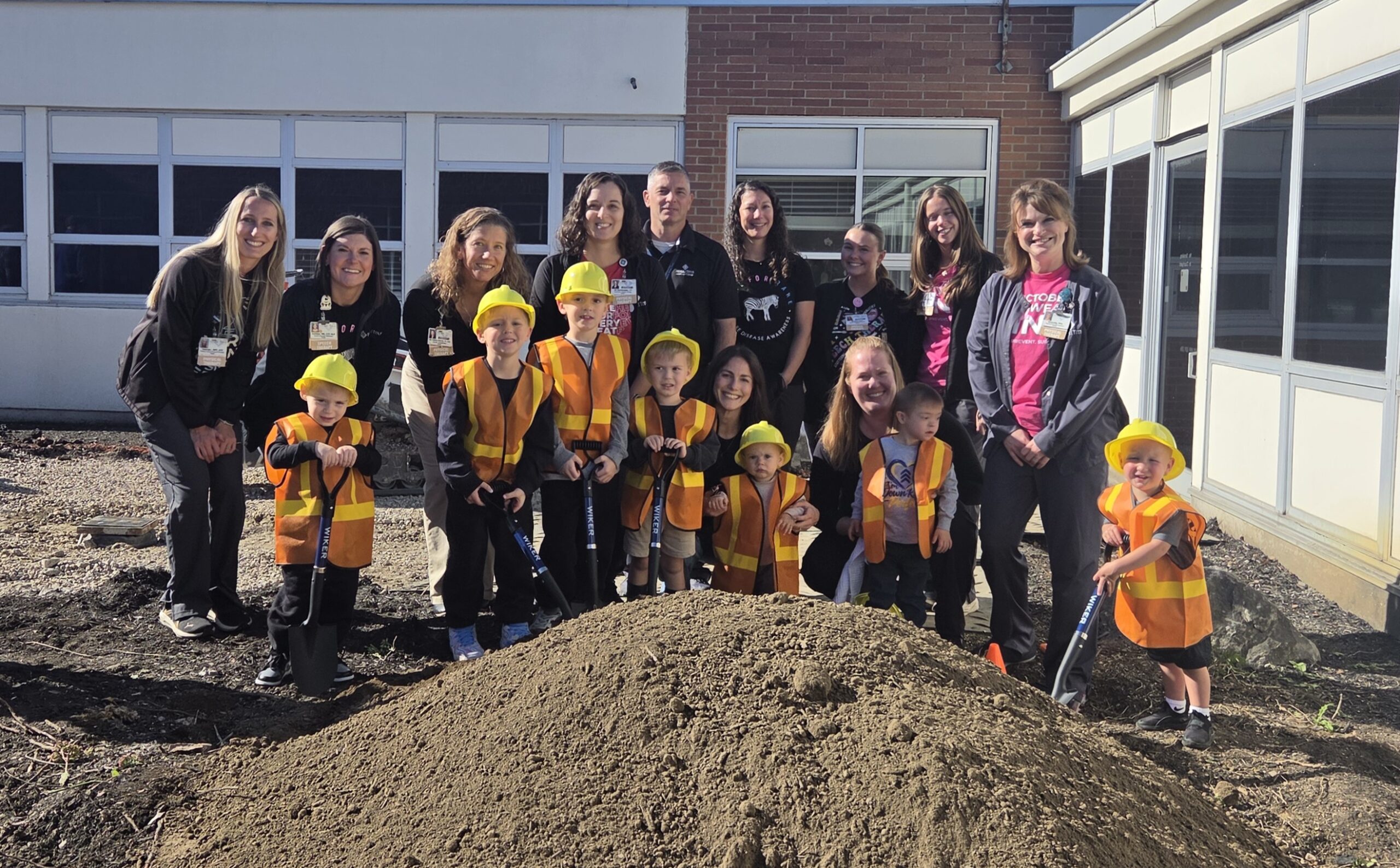 Kids with Pediatric Therapy team at groundbreaking ceremony for courtyard project